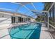 Large screened-in pool and patio area at 2057 Carson Ave, Spring Hill, FL 34608