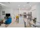 Modern kitchen featuring a breakfast bar and stainless steel appliances at 17399 Nectar Flume Dr, Land O Lakes, FL 34638