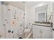 Clean bathroom with shower, toilet and granite countertop at 17399 Nectar Flume Dr, Land O Lakes, FL 34638