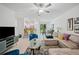 Open concept living area with comfy seating and views to the kitchen at 17399 Nectar Flume Dr, Land O Lakes, FL 34638
