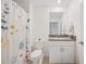 Bathroom with shower/tub combo, toilet and granite vanity at 17399 Nectar Flume Dr, Land O Lakes, FL 34638