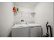 Bright laundry room with washer and dryer at 17399 Nectar Flume Dr, Land O Lakes, FL 34638