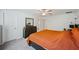 Spacious bedroom with large bed, dresser, and ensuite bathroom access at 17399 Nectar Flume Dr, Land O Lakes, FL 34638