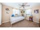 Cozy bedroom with a daybed, ceiling fan, and ample closet space at 1725 Dander Dr, Holiday, FL 34690