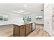 Spacious kitchen island with stainless steel appliances, and view of backyard, perfect for entertaining guests at 1650 Fallon Pass, Zephyrhills, FL 33541