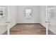 Bright room featuring wood-look floors and modern trim at 1650 Fallon Pass, Zephyrhills, FL 33541