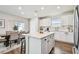 Modern kitchen with white cabinets, quartz countertops, and stainless steel appliances at 6611 Devlin Ln, Wesley Chapel, FL 33545