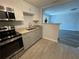 Modern kitchen with stainless steel appliances and granite countertops at 1024 Jadewood Ave, Clearwater, FL 33759