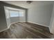 Bright bedroom with bay window and laminate wood flooring at 1024 Jadewood Ave, Clearwater, FL 33759