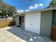 Back patio with access to a double door storage area at 1024 Jadewood Ave, Clearwater, FL 33759