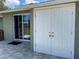 Back patio with access to storage shed at 1024 Jadewood Ave, Clearwater, FL 33759