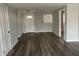 Bright living room with wood-look floors and neutral walls at 1024 Jadewood Ave, Clearwater, FL 33759