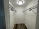 Large walk-in closet with wire shelving and hanging rods at 1024 Jadewood Ave, Clearwater, FL 33759