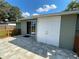 Back patio with access to storage shed at 1024 Jadewood Ave, Clearwater, FL 33759
