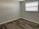 Spacious bedroom with gray walls and wood-look floors at 1024 Jadewood Ave, Clearwater, FL 33759