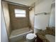 Updated bathroom with tile shower and granite countertop at 1024 Jadewood Ave, Clearwater, FL 33759
