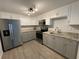 Updated kitchen with stainless steel appliances and granite countertops at 1024 Jadewood Ave, Clearwater, FL 33759