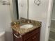Clean bathroom featuring granite countertop and new sink at 1024 Jadewood Ave, Clearwater, FL 33759