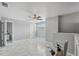 Grey bedroom with tile flooring and ceiling fan at 6435 Thicket Trl, New Port Richey, FL 34653