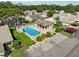 Community pool with patio and lounge chairs at 6435 Thicket Trl, New Port Richey, FL 34653