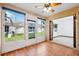 Sunroom with tile flooring and access to the backyard at 6435 Thicket Trl, New Port Richey, FL 34653
