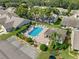 Community pool area with surrounding landscaping at 6435 Thicket Trl, New Port Richey, FL 34653
