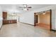 Spacious living room with tile flooring and access to a dining area at 6435 Thicket Trl, New Port Richey, FL 34653