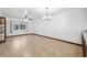 Spacious dining room with tile floors and a chandelier at 6435 Thicket Trl, New Port Richey, FL 34653