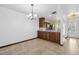 Dining area with tile floors and kitchen access at 6435 Thicket Trl, New Port Richey, FL 34653