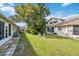 Community backyard with lush landscaping and walkways at 6435 Thicket Trl, New Port Richey, FL 34653
