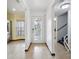 Bright entryway with tile floors, and access to the living room and stairs at 6435 Thicket Trl, New Port Richey, FL 34653