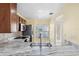 Modern kitchen with stainless steel appliances and granite countertops at 6435 Thicket Trl, New Port Richey, FL 34653
