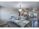 Bright dining room features a rustic table with blue benches and a view of the kitchen at 4041 Star Island Dr, Holiday, FL 34691