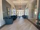 Community lobby with seating area and hardwood floors at 11720 Renaissance Blvd, Venice, FL 34293