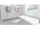 Bright bathroom featuring double vanity, soaking tub, and modern finishes at 22426 Golden Retriever Ln, Brooksville, FL 34601