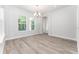 Bright and airy dining room with large windows and wood flooring at 22426 Golden Retriever Ln, Brooksville, FL 34601