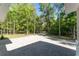 Long paved driveway leads to this wooded home, surrounded by trees at 22426 Golden Retriever Ln, Brooksville, FL 34601