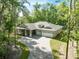 Beautiful home with a three car garage, long driveway, and charming curb appeal at 22426 Golden Retriever Ln, Brooksville, FL 34601