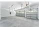 Spacious three-car garage featuring high ceilings and ample space at 22426 Golden Retriever Ln, Brooksville, FL 34601