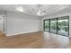 Spacious bedroom with tray ceiling, sliding glass doors, and scenic views of the lake at 4000 Southern Valley Loop, Brooksville, FL 34601