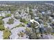 Aerial view of the community featuring mature trees and well-maintained landscaping at 428 Windrush Bay Dr, Tarpon Springs, FL 34689