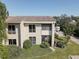 Condo featuring green space, mature trees, and a serene setting with lush landscaping at 428 Windrush Bay Dr, Tarpon Springs, FL 34689