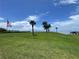 Scenic green space with manicured grass and waterfront views, perfect for relaxation and recreation at 428 Windrush Bay Dr, Tarpon Springs, FL 34689
