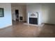 Living room with tile flooring, featuring a decorative brick fireplace at 480 82Nd Ave, St Pete Beach, FL 33706