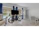 Living room featuring a large window, TV, and unique decor at 2298 Netherlands Dr # 4, Clearwater, FL 33763