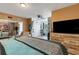 Bedroom with large bed, dresser, and view into the living room at 2298 Netherlands Dr # 4, Clearwater, FL 33763