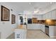 Kitchen with white cabinets, granite counters and island at 2298 Netherlands Dr # 4, Clearwater, FL 33763