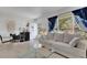 Living room with light-grey couch and glass coffee table at 2298 Netherlands Dr # 4, Clearwater, FL 33763