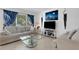 Living room with couch and decorative wall art at 2298 Netherlands Dr # 4, Clearwater, FL 33763