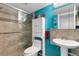 Updated bathroom with walk-in shower, toilet and pedestal sink at 2298 Netherlands Dr # 4, Clearwater, FL 33763